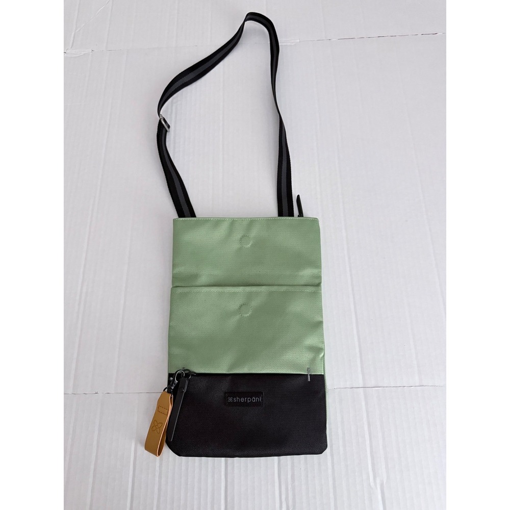 Sherpani Sage Green Black Slim Crossbody Travel Bag Adjustable Multi-Pocket Bag